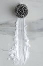 Vertical image.Top view of wire cleaning brush and baking soda on the white marble kitchen table