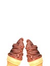 Two Chocolate Coating Soft Serve Ice Cream Cones Clinking on White Background Royalty Free Stock Photo