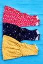 Vertical image of vintage baby dresses.