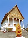 Vertical image of Wat That Luang Nua buddhist temple, the temple next to PhaThat Luang stupa in Vientiane, Laos
