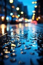 Vertical image of a wet street pavement surface covered with water drops