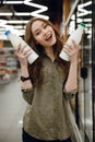 Vertical image of woman holding bottle milk
