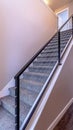 Vertical Indoor staircase against brown wooden floor and plain white wall of home