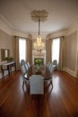 Vertical inside shot of a nice living room with a table and chairs in a house in New Orleans Royalty Free Stock Photo