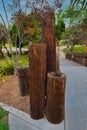 Vertical of an installation made of logs on the campus of San Diego State University. Royalty Free Stock Photo