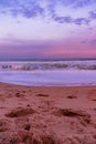 Vertical landscape shot of a beautiful colorful sunset at the beach Royalty Free Stock Photo