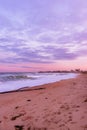 Vertical landscape shot of a beautiful colorful sunset at the beach Royalty Free Stock Photo