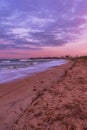 Vertical landscape shot of a beautiful colorful sunset at the beach Royalty Free Stock Photo