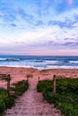 Vertical landscape shot of a beautiful colorful sunset at the beach Royalty Free Stock Photo