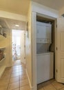 Vertical Laundry room living room and bathroom at the interior of home with white wall