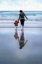 Mother and Young Child Reflection on Beach Vertical Royalty Free Stock Photo