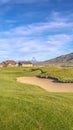 Vertical Long meandering sand trap on a golf course Royalty Free Stock Photo