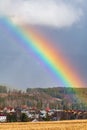 Vertical low-angle of Ankeny Hill Nature center with a rainbow and cloudy sky background Royalty Free Stock Photo