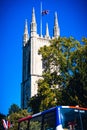 Vertical low-angle of the Blackburn Cathedral with the United Kingdom flag on top on a sunny day Royalty Free Stock Photo