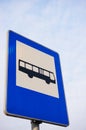 Vertical low angle of a blue bus stop sign Royalty Free Stock Photo