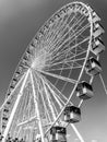Vertical low-angle grayscale of a Ferris wheel in Great Yarmouth seafront park