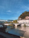 Vertical low-angle Grenoble bridge with buildings and clear sky background
