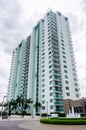 Vertical low angle of high-rise building against cloudy sky Royalty Free Stock Photo