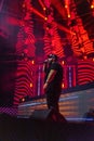 Vertical low-angle of a male singer performing on the stage during Electric Love Music Festival