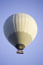 Vertical low angle shot of air balloons in the air under the clear blue sky Royalty Free Stock Photo