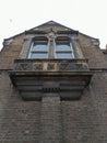 Vertical low angle shot of a beautifully architectured ancient stone-made building