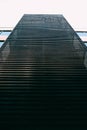 Vertical low angle shot of a black building with unique textures Royalty Free Stock Photo