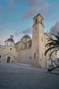 Vertical low angle shot of a church with a tree. Beautiful architecture in Altea Spain