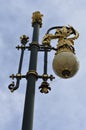 Vertical low angle shot of a historic street lamp with the golden french lily symbol Royalty Free Stock Photo