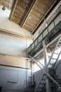 Vertical low angle shot inside a huge factory Royalty Free Stock Photo