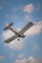 Vertical low angle shot of a light aircraft Royalty Free Stock Photo