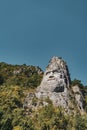 Vertical low angle shot of the magnificent Rock Sculpture of Decebalus captured in Romania Royalty Free Stock Photo