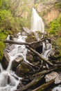 Vertical low angle shot of a majestic waterfall Royalty Free Stock Photo