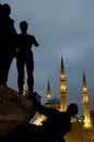 Vertical low angle shot of the  Martyrs\' monument in front of the Mohammad Al-Amin Mosque, Beirut Royalty Free Stock Photo