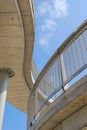 Vertical low angle shot of modern stone building on blue sky background Royalty Free Stock Photo