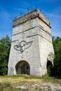 Vertical low angle shot of a monument with an eagle carving in Ligota Dolna village in Poland