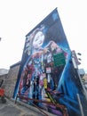 Vertical low angle shot of a painted beautiful oriental mural on the side of a building in Bristol