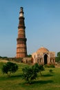 Vertical low angle shot of Qutub Minar monument in Delhi, India under the beautiful blue sky Royalty Free Stock Photo