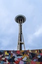 Vertical low angle shot of Space Needle behind a colorful mural in Seattle, United States