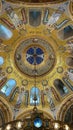 Vertical low angle shot of a stunningly ornate church ceiling in Vienna, Austria