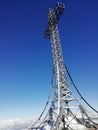 Vertical low angle shot of Summit cross in Monte Catria, Italy during winter