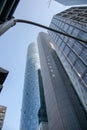 Vertical low angle shot of tall glass modern buildings