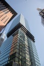 Vertical low angle shot of tall glass modern buildings