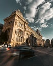 Vertical low-angle view of the National Museum of Romanian history under the cloudy sky Royalty Free Stock Photo