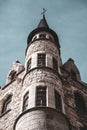 Vertical low-angle view of the tower of Casa Botines under the blue sky Royalty Free Stock Photo