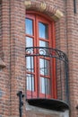 Vertical low-angle view of a vintage balcony of a brick-built building