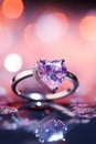 vertical macro silver ring with a large purple heart shaped gemstone on a blurred background Royalty Free Stock Photo