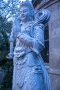 Vertical of a marble statue of Buddha in New York