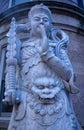 Vertical of a marble statue of Buddha in New York