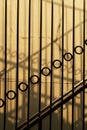 Vertical metallic fence shadow on concrete wall architecture background