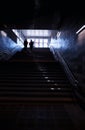 Vertical metro stairs with dramatic light leak city background Royalty Free Stock Photo